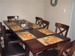 The dinning table and tableware accomidates up to 8 place settings.